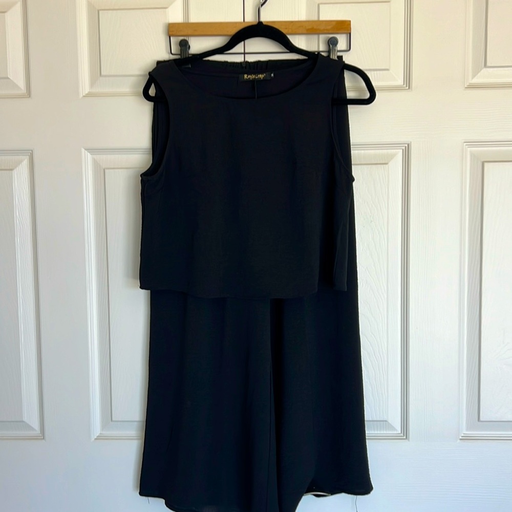 Black Two piece set. Crop sleeveless top, wide leg crop pants.